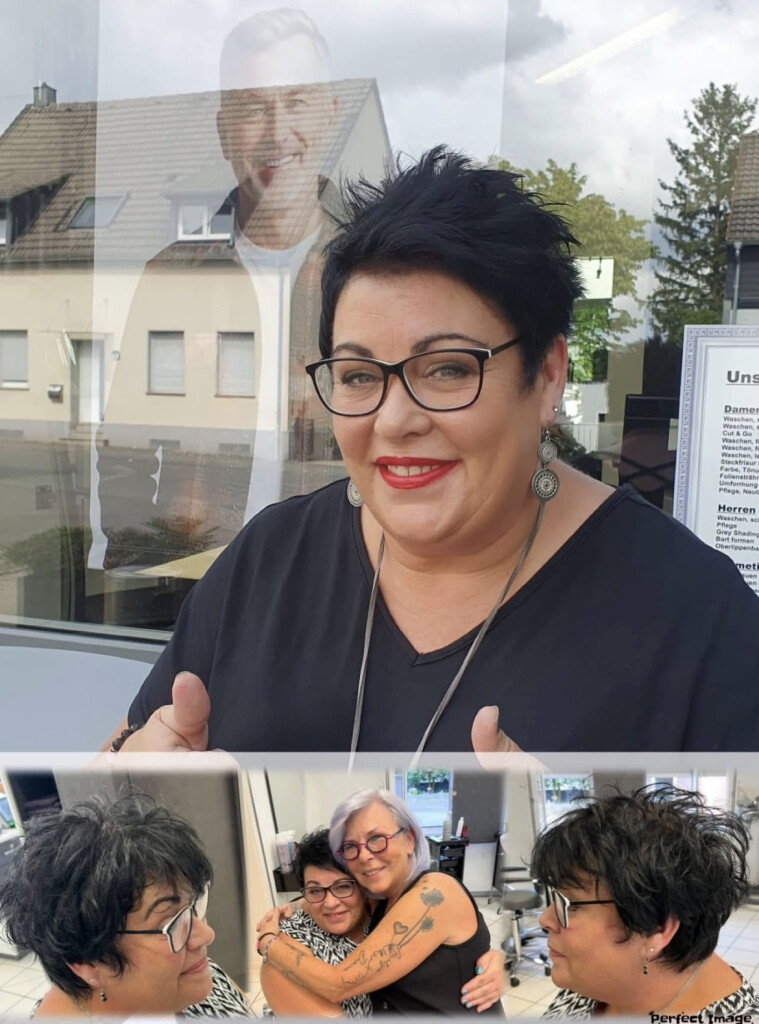 Lächelnde Stylistin von Salon Lora Hairstyle vor dem Schaufenster des Salons